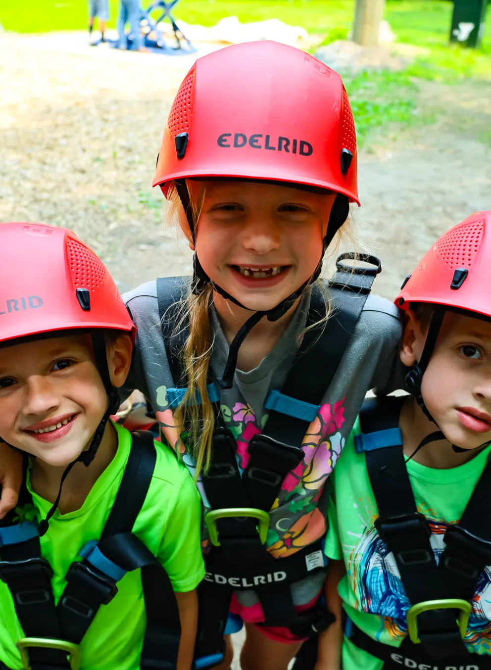 Three Kids SMiling at Summer Camp in Rock Climbing Gear