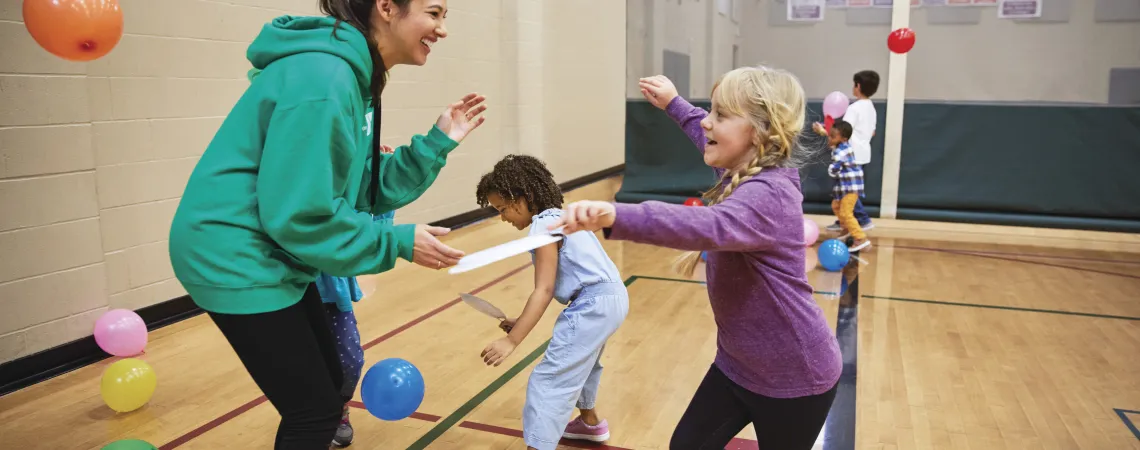 Kids playing with balloons during a birthday party