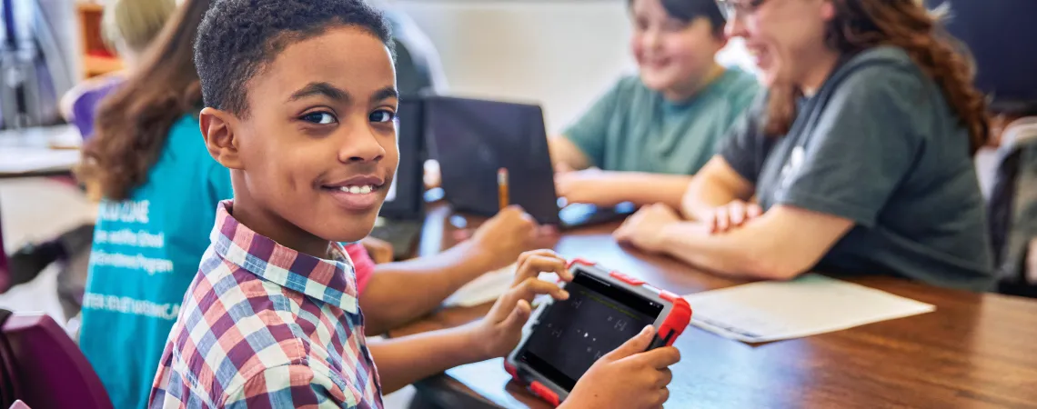 Boy play a game on a tablet