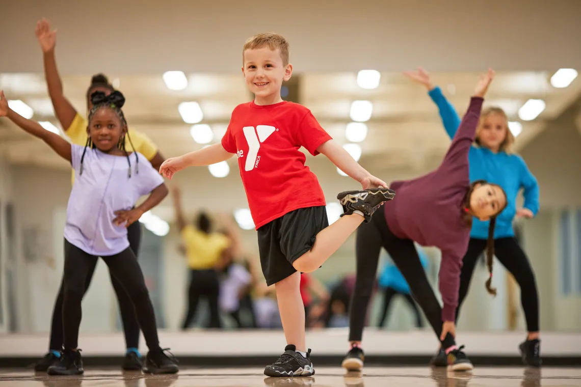 Four girls and a boy dancing